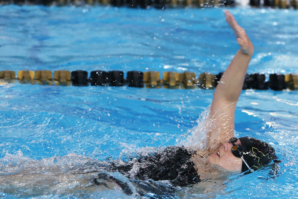 Keesee Bennett-McDonnell pulls herself backward during the 100-yard backstroke